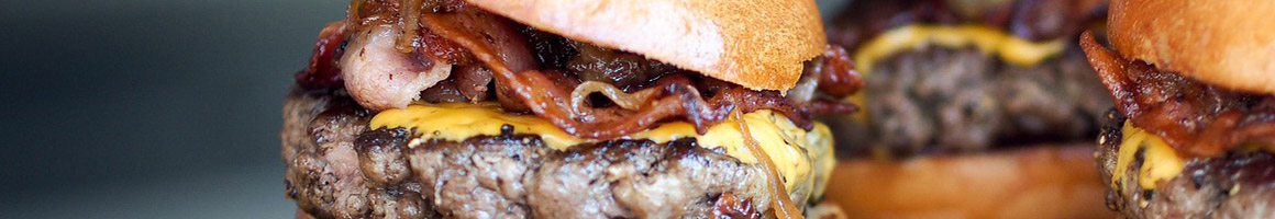 Eating American (Traditional) Burger at Gooseboro Drive-In restaurant in Bantam, CT.